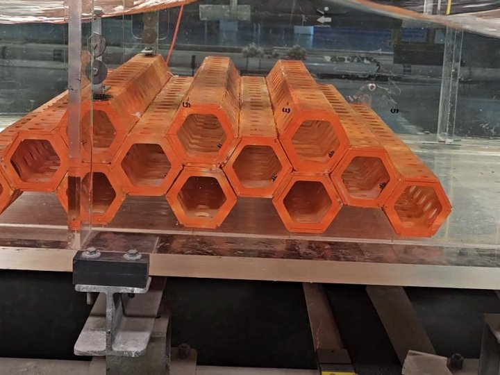 Twelve-unit three-peak SEAHIVE model under a wave